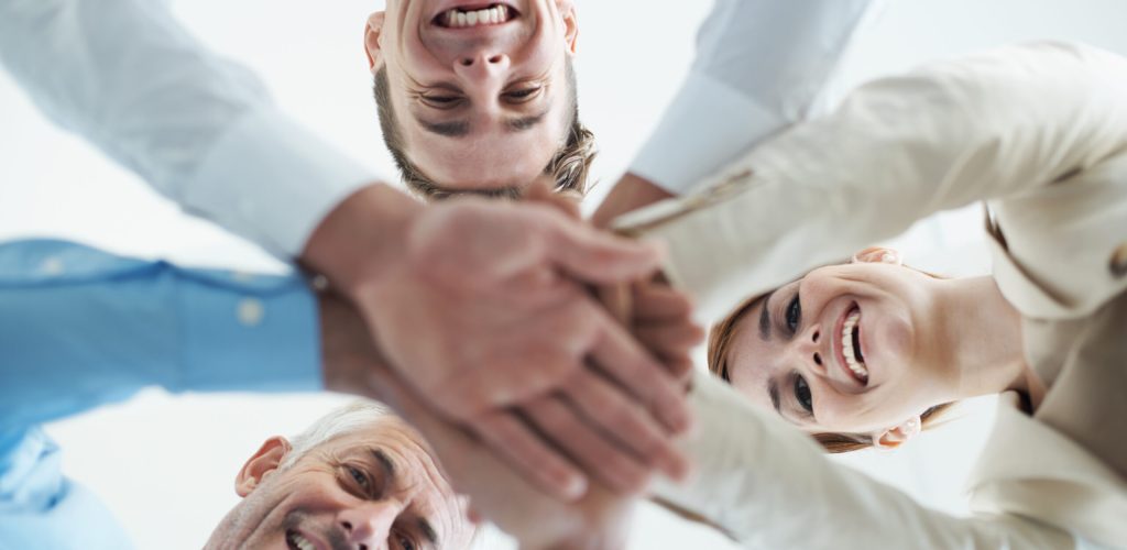 Lets do this. Portrait of a group of business people standing in a huddle
